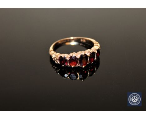 A 9ct gold five-stone garnet ring, size O CONDITION REPORT: 3.1g