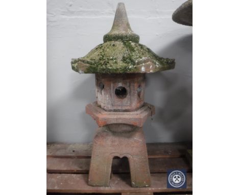 A concrete garden pagoda lantern and two wall pockets 
