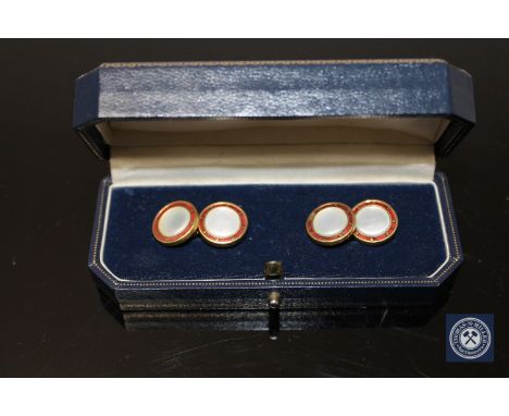 A pair of 18ct gold, mother of pearl and enamel cufflinks