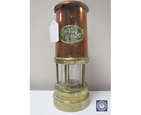 A Welsh brass and copper miner's lamp