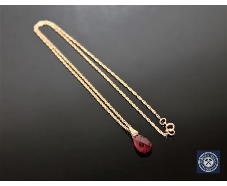 A garnet drop pendant on 9ct gold chain