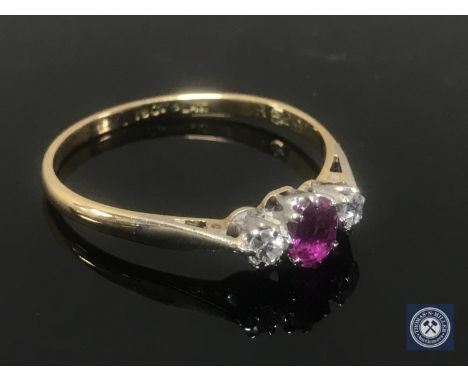 An 18ct gold ruby and diamond ring, size S/T