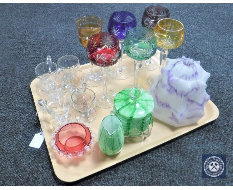 A tray of coloured hock glasses, cranberry glass bowl, green glass sugar basin and jug, Art Deco marbled glass light shade et