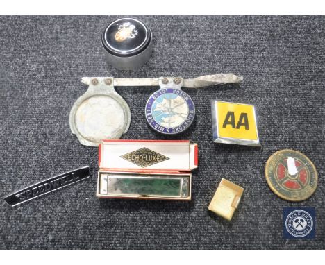 A box of Wind deluxe lighter, Hohner Echo-Luxe mouth organ and assorted car badges