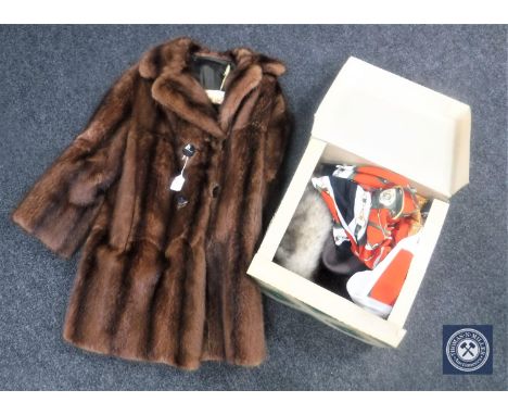 A lady's vintage fur coat together with a box of hats, leather hand bags, two piece suit etc