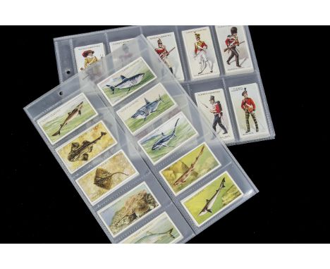 Cigarette Cards, Players,a modern album containing  12 various sets to include Sea Fishes, Regimental Uniforms, Uniforms of t