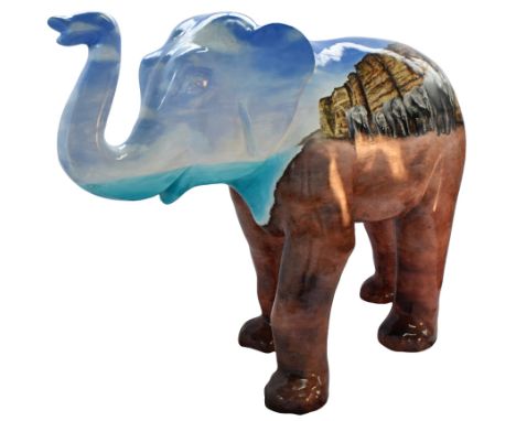 Wending Our Way Down West Bay'My design features a family herd of elephants walking together on the beach in front of the ico