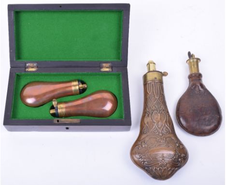 Gun Sized Embossed Copper Powder Flask, a leather shot bag with sprung brass shovel charger, and a pair of modern copper pist