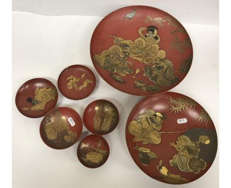 A collection of circa 1900 Japanese cinnabar lacquered and gilt decorated bowls comprising a large bowl decorated with three 