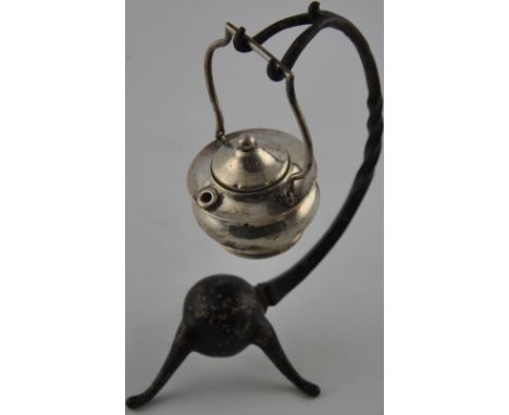 A silver table lighter formed as a cauldron on stand, hallmarked Birmingham 1908 by Levi of Salaman