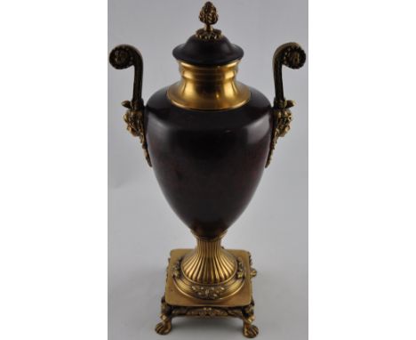 A large brass twin handled urn