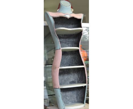 A painted four tier open display unit modelled as a tailor's mannequin together witn a tall bleachwood two tier stand