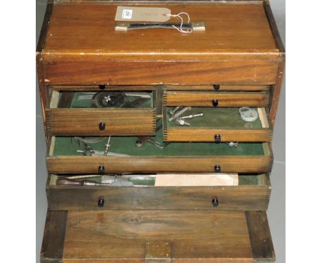 An early 20th century Moore & Wright mahogany tool chest containing a quantity of steel precision engineering tools, pocket b