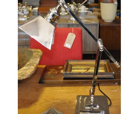 An Art Deco style nickel plated desk lamp with tapered square shade on stepped square base 