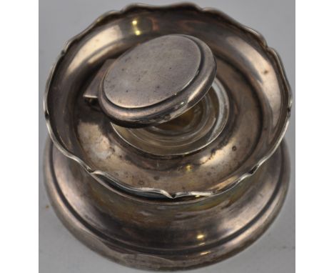 A silver inkwell with glass liner, circa 1900