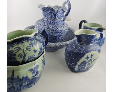 A Victorian style blue and white pottery wash jug and basin together with two similar jugs, a chamber pot and a vase