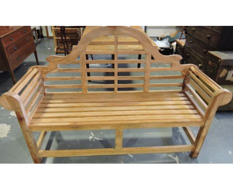 A Lutyens style slatted Teak garden bench