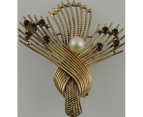 A 9ct yellow gold ruby and pearl set brooch of knotted strand form, 6.8 grams