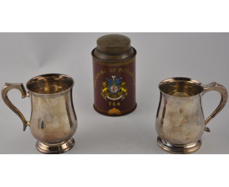 A near pair of silver plated baluster pipe tankards together with a Jackson's tin tea caddy