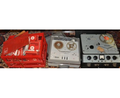 A vintage Ferrograph reel to reel tape recorder together with a later Elizabethan reel to reel recorder and a quantity of tap