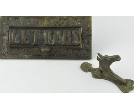 A late Victorian cast brass letterbox L 24 cms together with a horse head door knocker.
