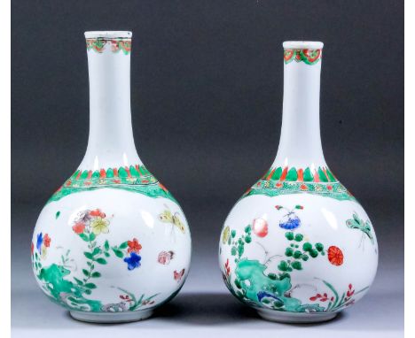 A pair of Chinese porcelain bottle-shaped vases enamelled in "Famille Verte" palette with butterflies, birds and flowers in t