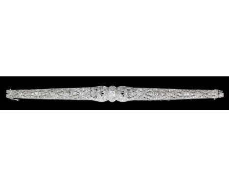 A good 1920's/1930's silvery coloured metal and all diamond set bracelet, the shaped centre panel set with old cut diamond be