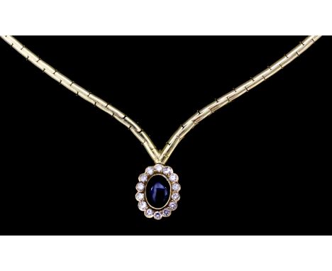 A modern 420mm 18ct gold mounted articulated cabochon sapphire and diamond set necklace, the centre sapphire being approximat