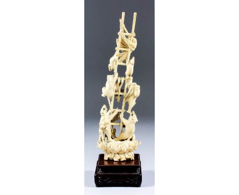 A Japanese carved ivory figural group of rats energetically climbing a ladder, topped by a fly whisk, on lotus pattern base, 