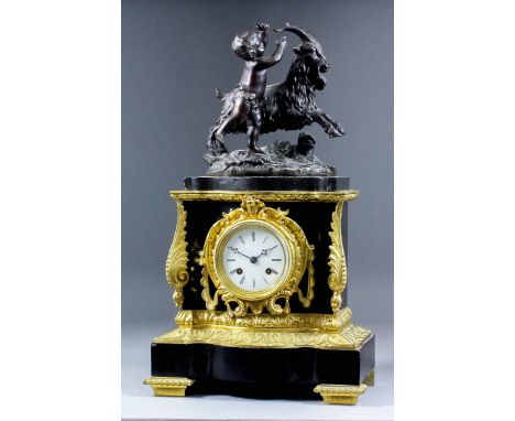 A 19th Century French gilt brass and bronzed metal cased mantel clock by Raingo Freres, No. 2210, the 3ins diameter white ena