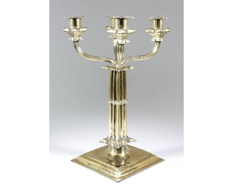 A Charles II silver gilt pillar candlestick with later four-light candelabra branch, the square column formed of triple colum