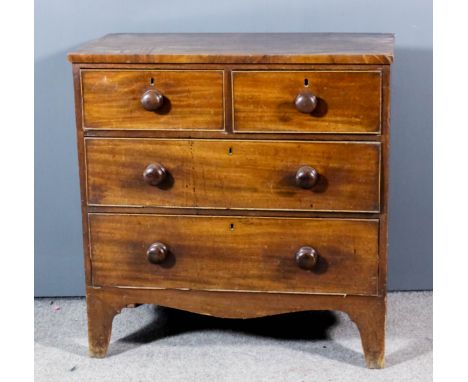 A late Georgian mahogany and pine sided chest with square edge to top, fitted two short and two long drawers, on shaped apron