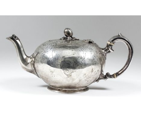 An early Victorian silver circular teapot of squat form with pomegranate and leaf pattern finial, the whole engraved with scr