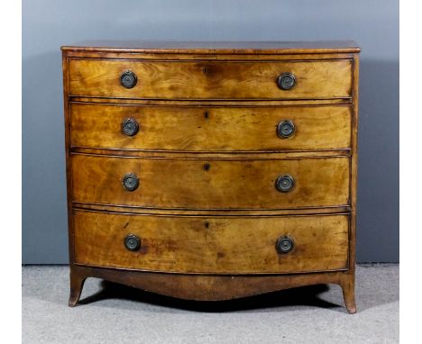 A late George III mahogany bow front chest, the top crossbanded and with rounded edge mouldings, fitted four long graduated d