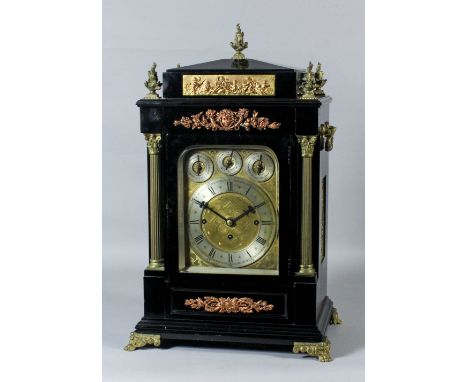A late Victorian ebonised and gilt brass mounted mantel clock of large proportion, the engraved gilt dial with 7.25ins silver