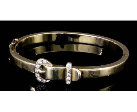 A gold coloured metal mounted diamond set buckle bangle, buckle and bar being pave set with diamonds (gross weight 18 grammes