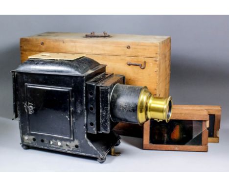 A late 19th Century black japanned metal and lacquered brass magic lantern, 16ins x 6ins x 10.25ins high (chimney and burner 