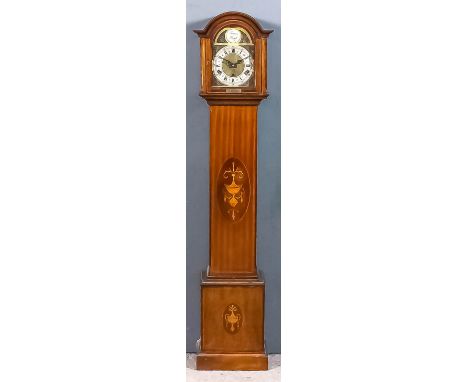 A 1930's mahogany "Grandmother" clock, the 6.5ins arched brass dial with silvered chapter ring with Roman and Arabic numerals