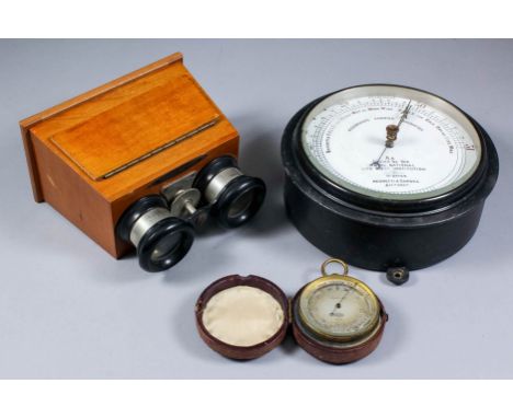A 19th Century gilt metal compensated pocket barometer by Casella of London, 2ins diameter, in red leather case, a Negretti &