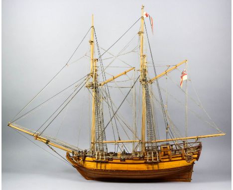 An English wooden scratch-built scale model of an 18th Century Royal Naval Man of War, fully rigged and with guns run out on 