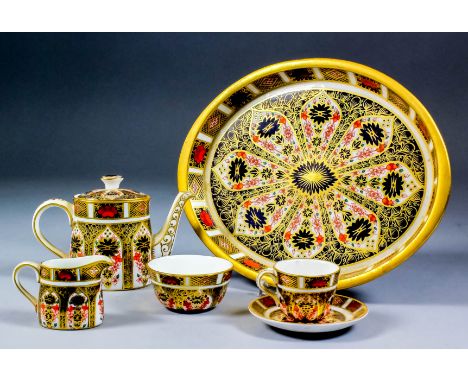 A Royal Crown Derby bone china "Imari" pattern miniature cabaret (Pattern No. 1128), comprising - oval tea pot, milk jug, suc