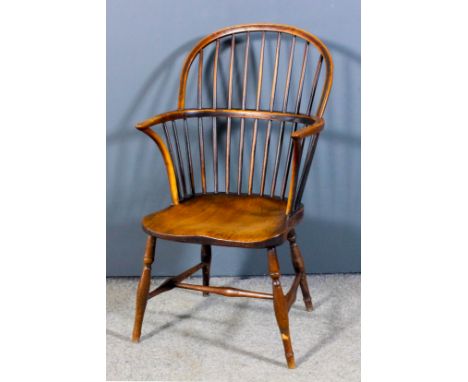 A 19th Century ash and elm seated stick back Windsor armchair with two tier stick back, dish seat on turned underframe