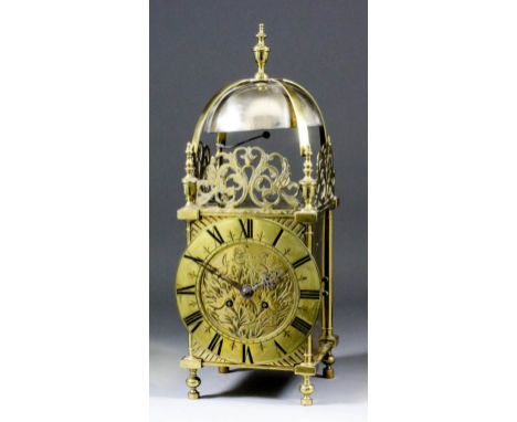 A late 19th/early 20th Century brass cased lantern clock, the 6.25ins diameter brass chapter ring with Roman numerals, the di