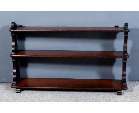 A mahogany rectangular three tier wall shelf on fretted end supports, 36ins wide x 6ins deep x 21ins high and a Victorian wal