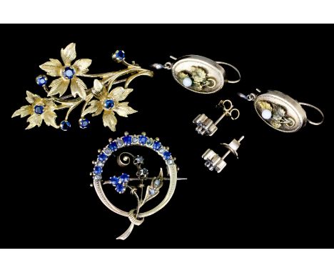 A 20th Century 9ct gold mounted sapphire set brooch, with seven sapphires in a sculptured floral array, 44mm x 25mm, a 9ct go