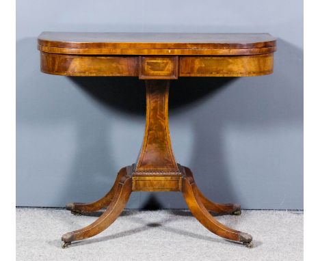 A late George III mahogany D-shaped card table, crossbanded and inlaid with rosewood bandings and stringings, the baize lined