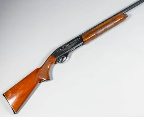 A 20 bore semi-automatic shotgun by Remington, model 1100, Serial No. M828844K, the 28ins blued steel barrel with elevated to