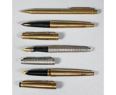 A Montblanc "Meisterstuck" No.84 piston fill fountain pen, a Parker gold coloured metal fountain pen, a Parker silver coloure