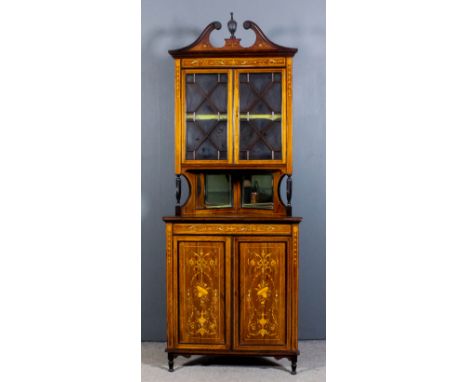 An Edwardian rosewood two tier corner cupboard, the whole inlaid with stringings, urns, ribbons, leaf scroll and bell flower 