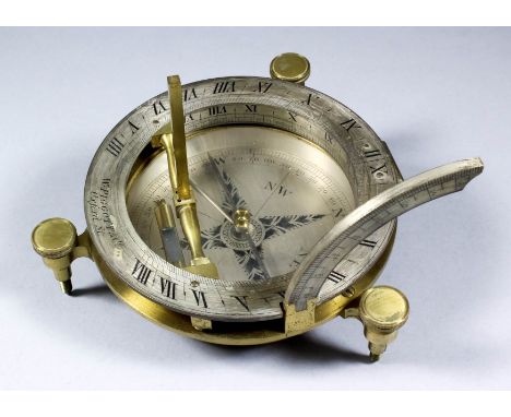 A 19th Century lacquered brass and silvered circular table top compass/sun dial by W. Piggott &amp; Co, Oxford Street, London